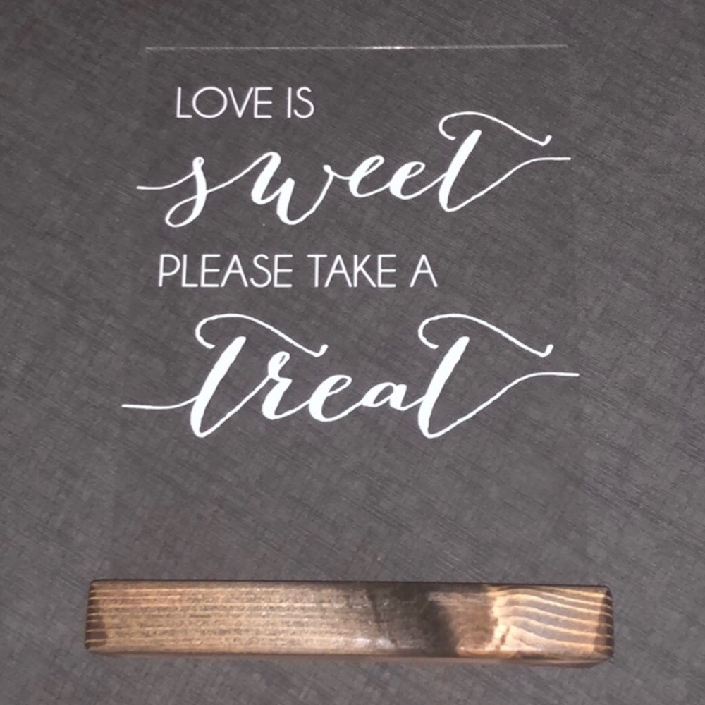“Love is sweet please take a treat” sign